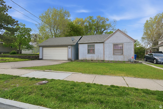 259 14th Street Ogden, UT 84404 - Photo 1 of 1 Ranch-style home featuring driveway, a front lawn, and an attached garage