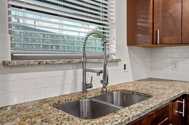 a kitchen with a sink and cabinets