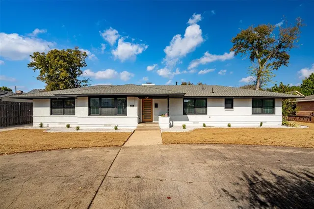 a house view with swimming pool and porch with seating space
