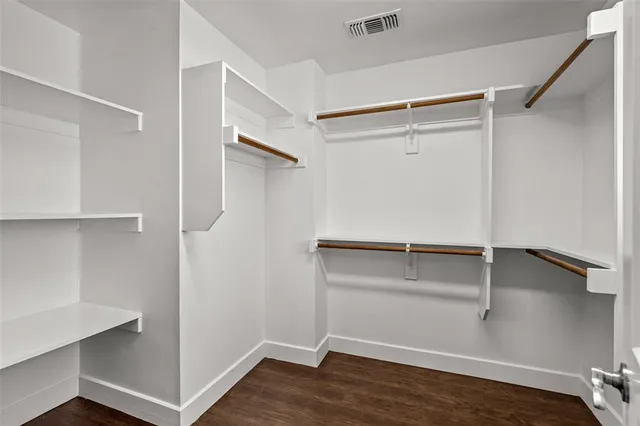 a view of an empty walk in closet