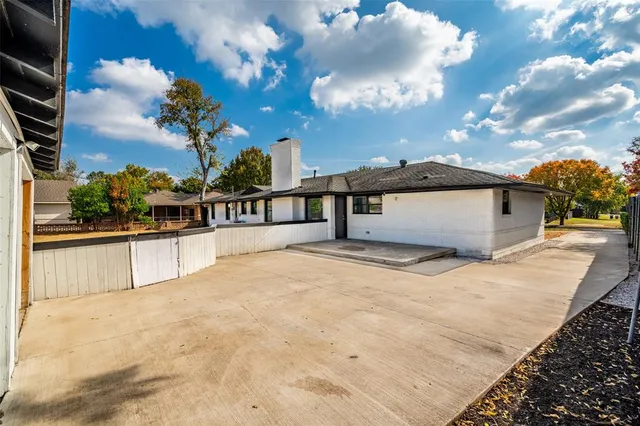 a view of swimming pool with a patio