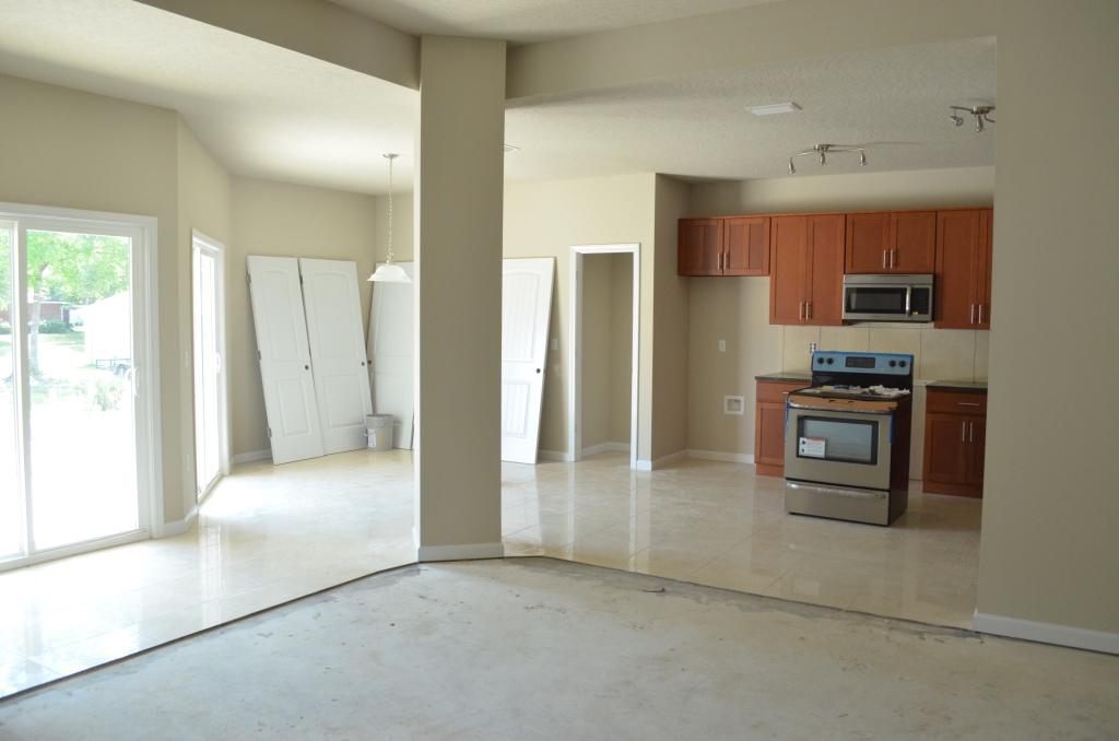 4604 Hermosa Road Crestview, FL 32539 - Photo 5 of 12 a kitchen with stainless steel appliances granite countertop a refrigerator and a stove