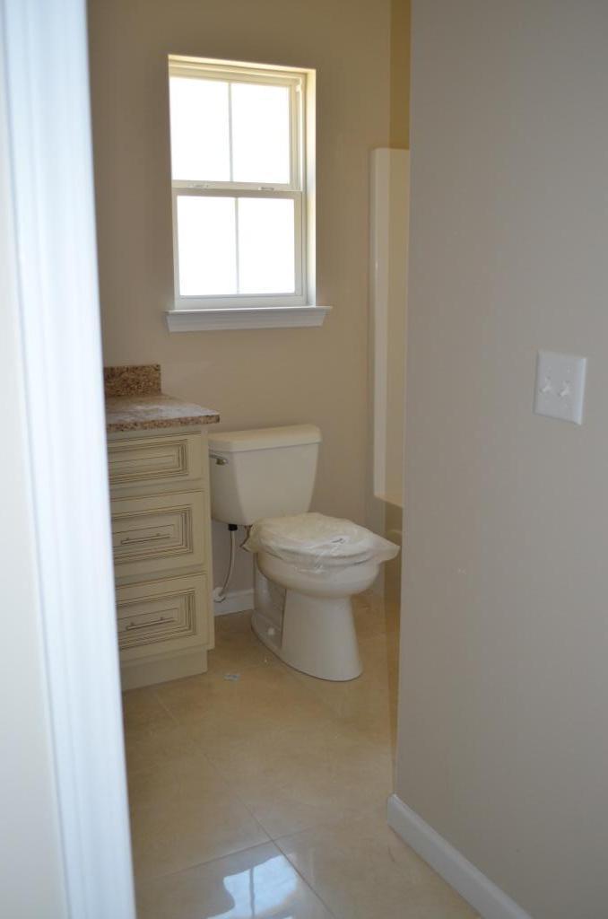 4604 Hermosa Road Crestview, FL 32539 - Photo 7 of 12 a bathroom with a toilet