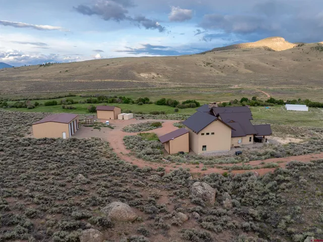 an aerial view of a house with a garden