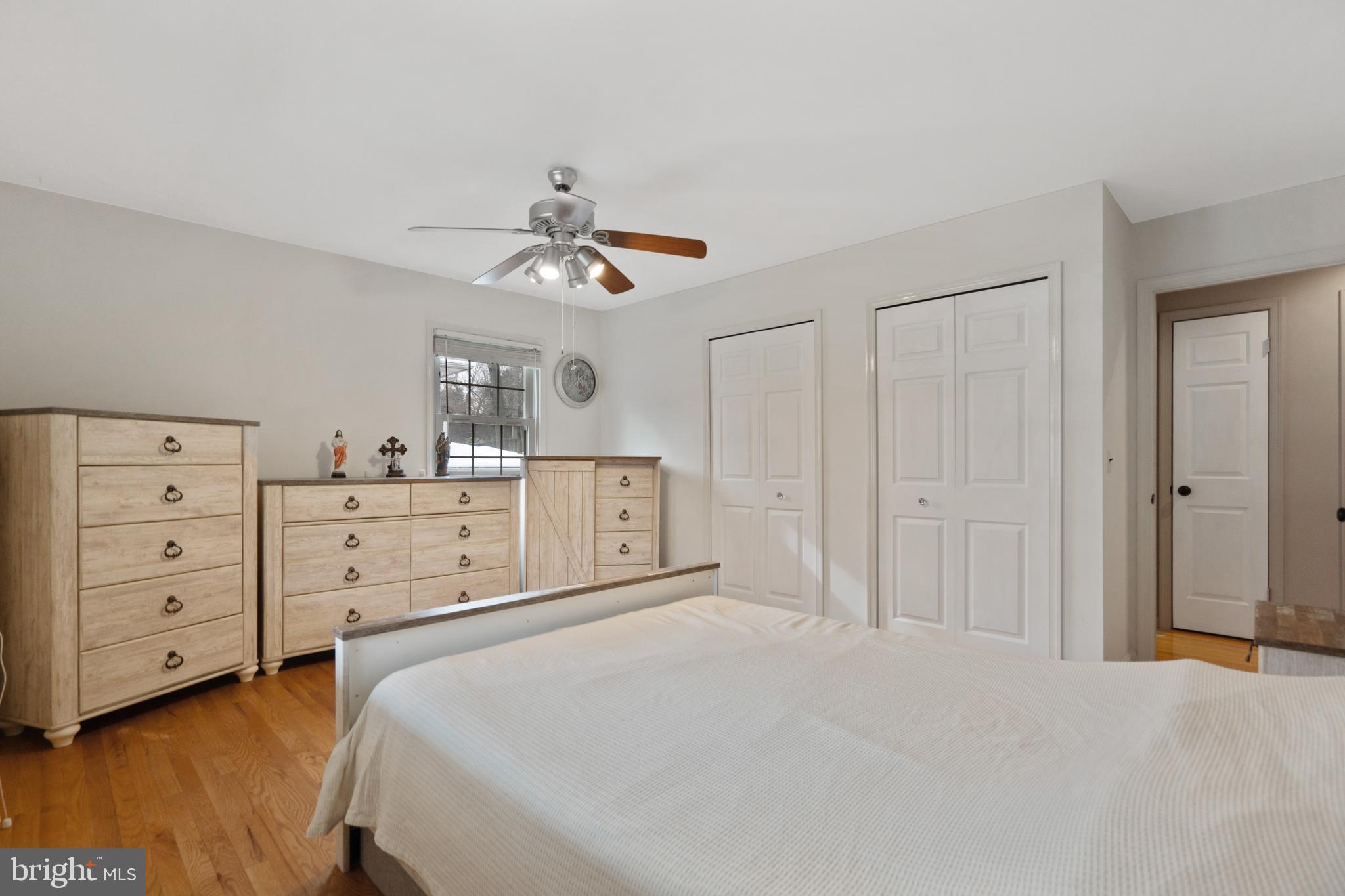 8702 Gateshead Road Alexandria, VA 22309 - Photo 14 of 42 a bedroom with a bed and a cabinets