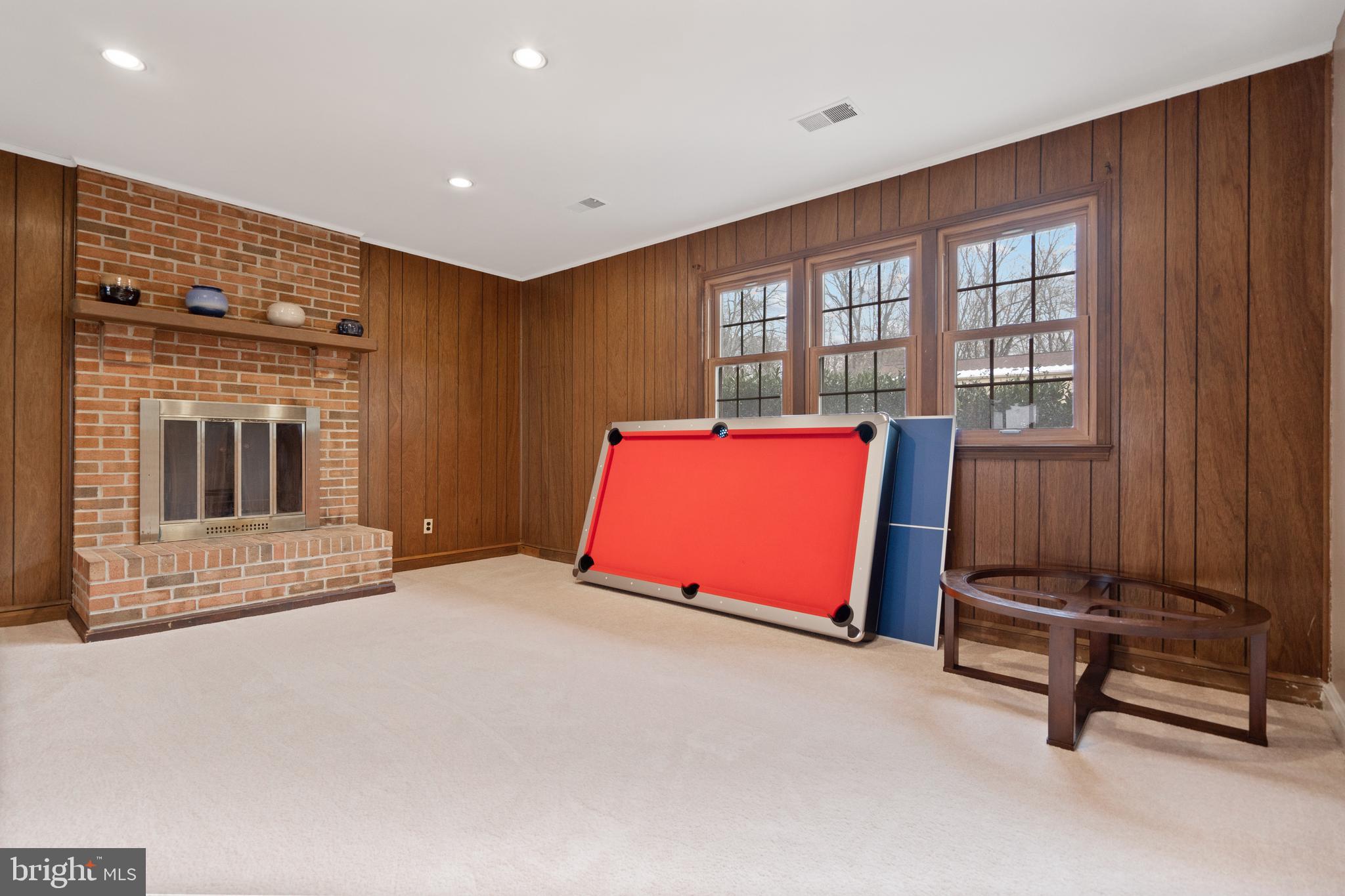 8702 Gateshead Road Alexandria, VA 22309 - Photo 18 of 42 a living room with a fireplace furniture and a ceiling fan