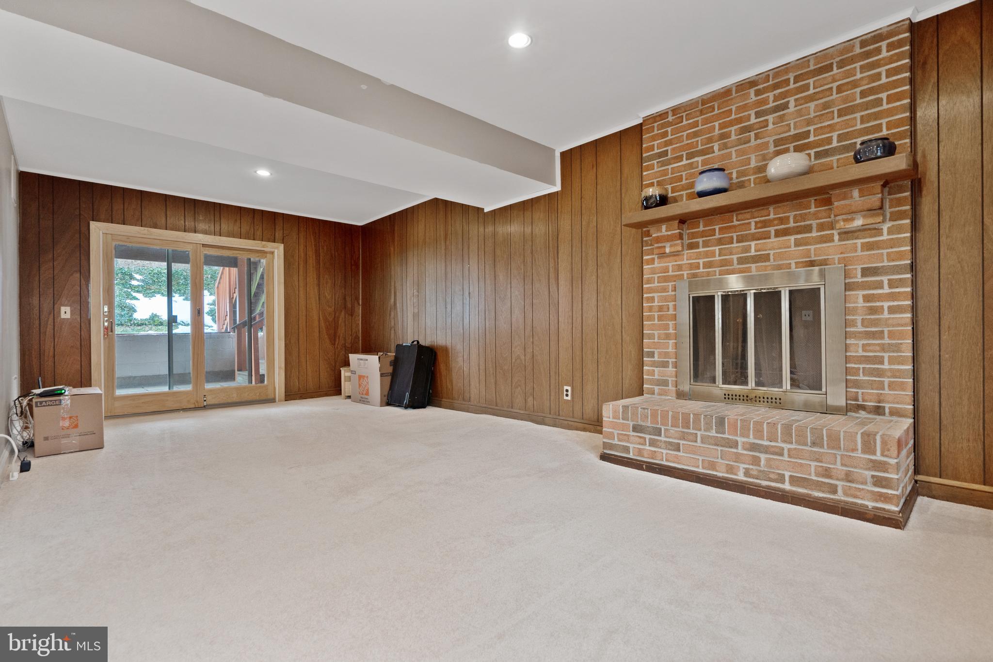 8702 Gateshead Road Alexandria, VA 22309 - Photo 19 of 42 a view of an empty room with a fireplace and a window