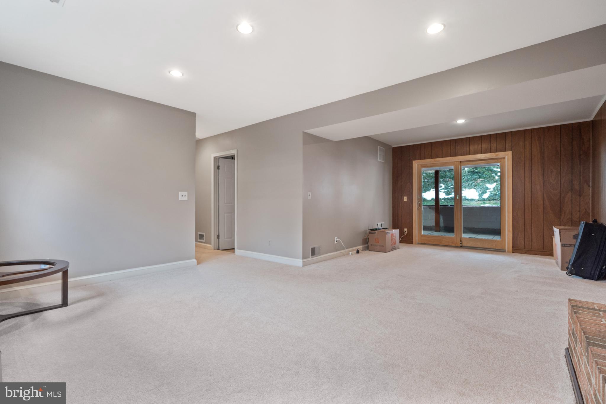8702 Gateshead Road Alexandria, VA 22309 - Photo 20 of 42 a view of an empty room with window and fire place
