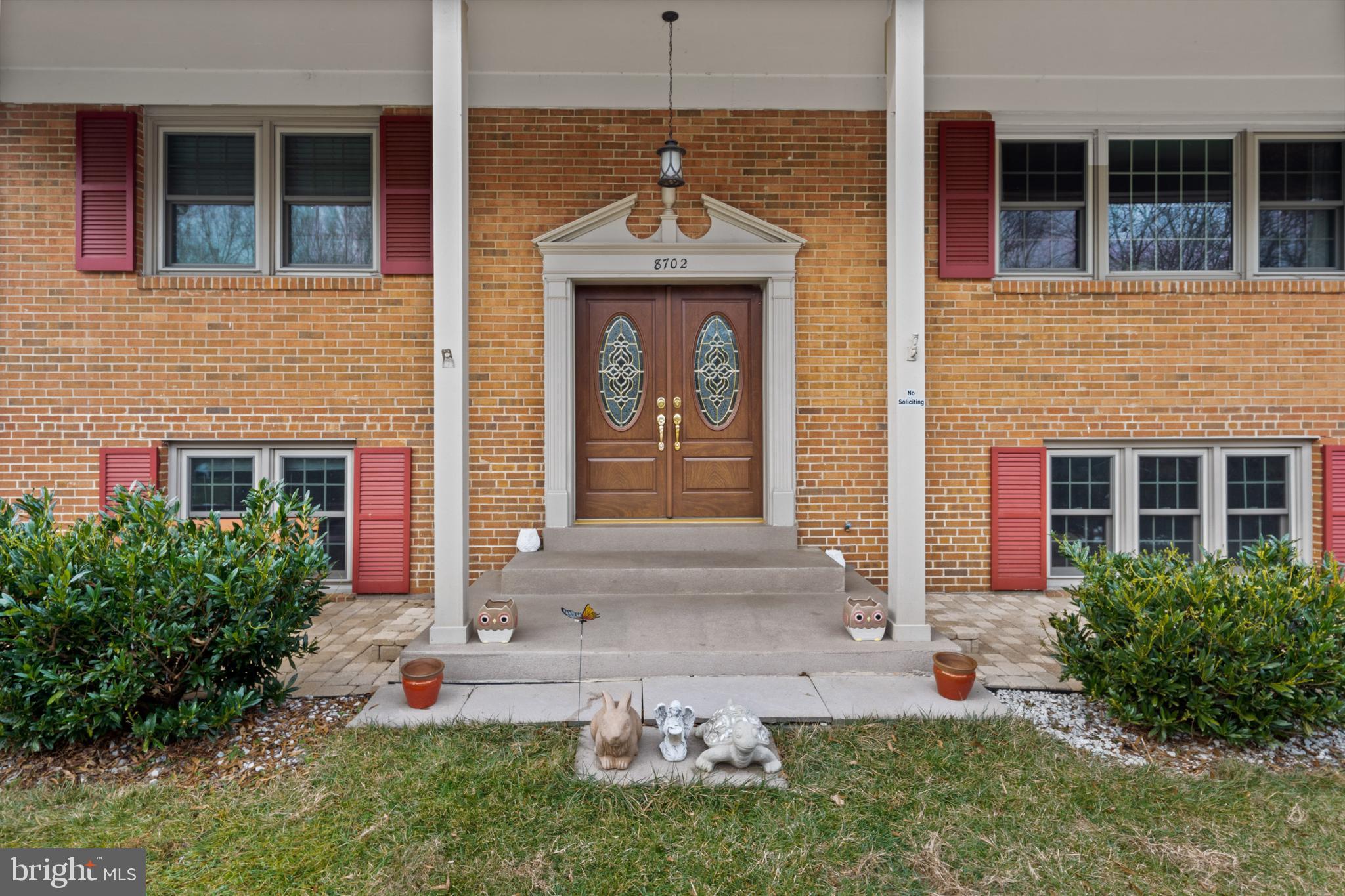 8702 Gateshead Road Alexandria, VA 22309 - Photo 2 of 42 a front view of a house with garden