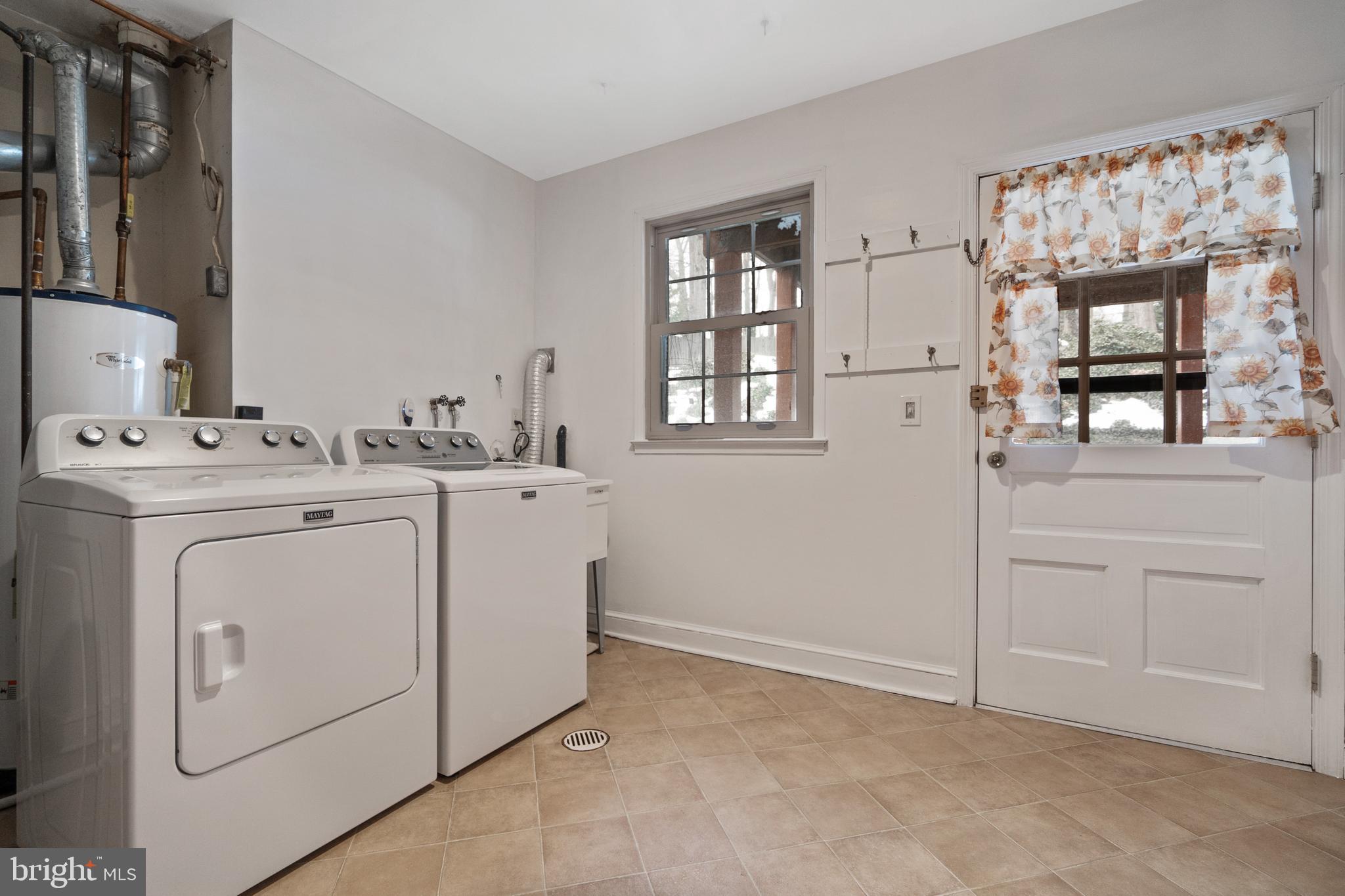8702 Gateshead Road Alexandria, VA 22309 - Photo 26 of 42 a utility room with closet dryer and washer