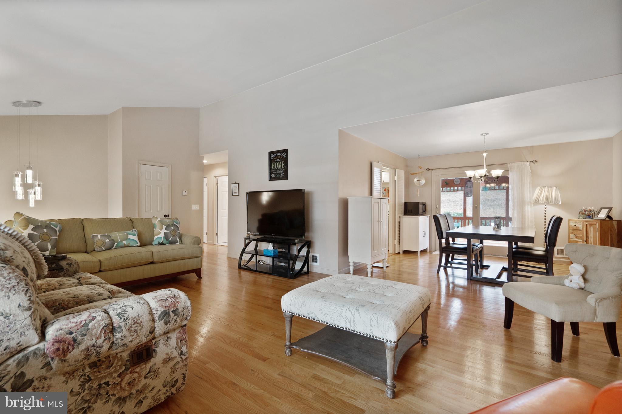 8702 Gateshead Road Alexandria, VA 22309 - Photo 4 of 42 a living room with furniture and a flat screen tv