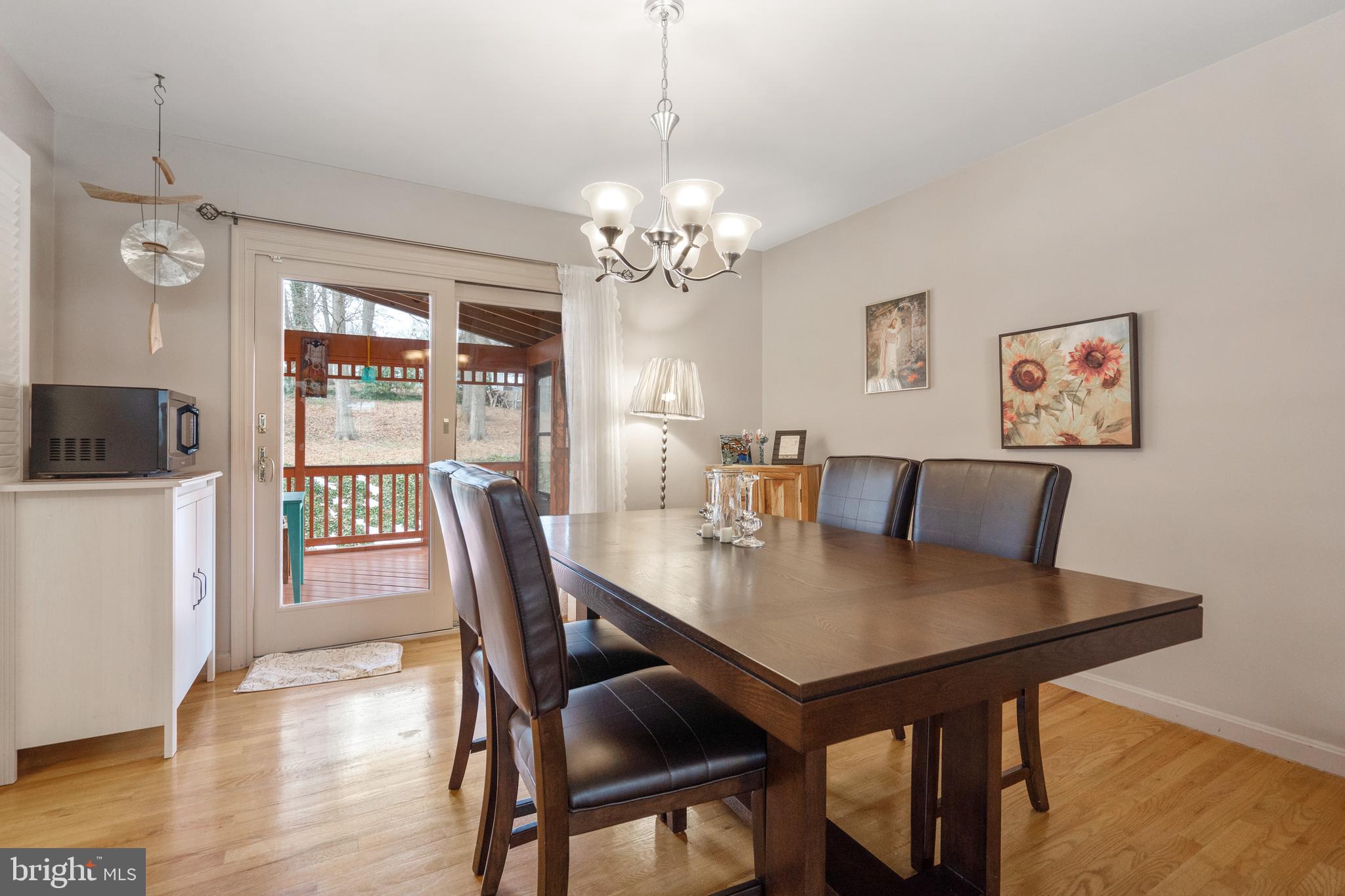 8702 Gateshead Road Alexandria, VA 22309 - Photo 6 of 42 a view of a dining room with furniture window and wooden floor
