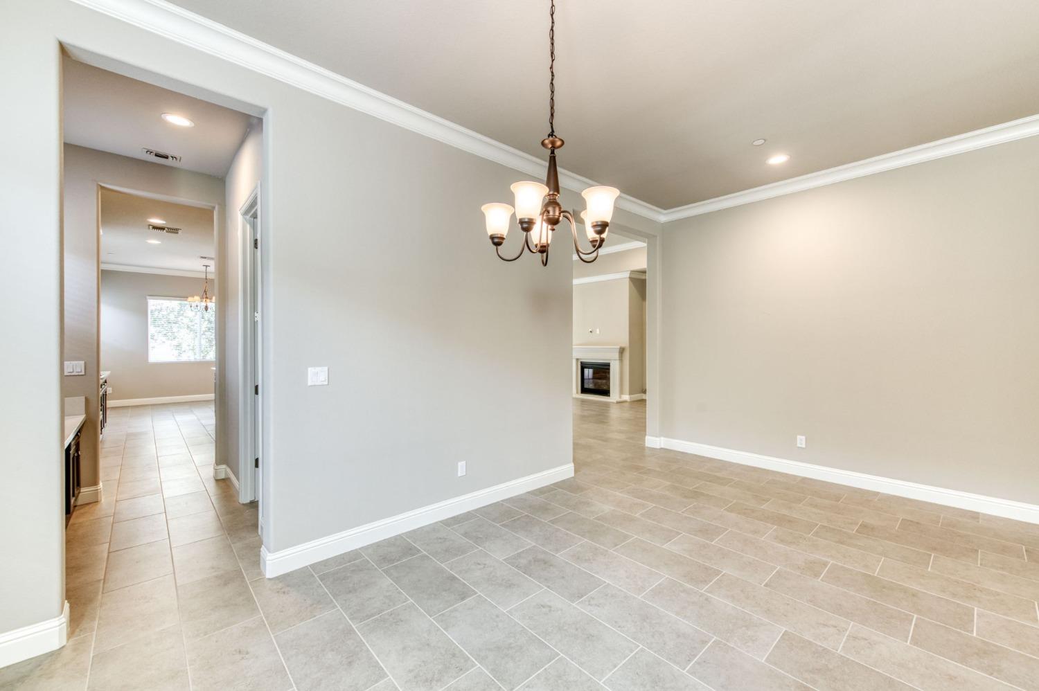 3301 Salem Avenue Clovis, CA 93619 - Photo 12 of 41 a view of a chandelier in a room and a mirror