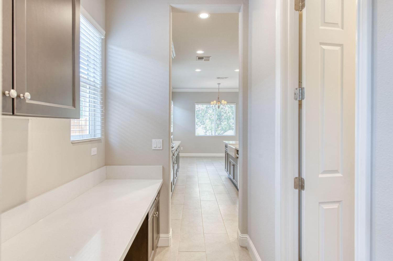 3301 Salem Avenue Clovis, CA 93619 - Photo 13 of 41 a bathroom with a sink and mirror with bathtub