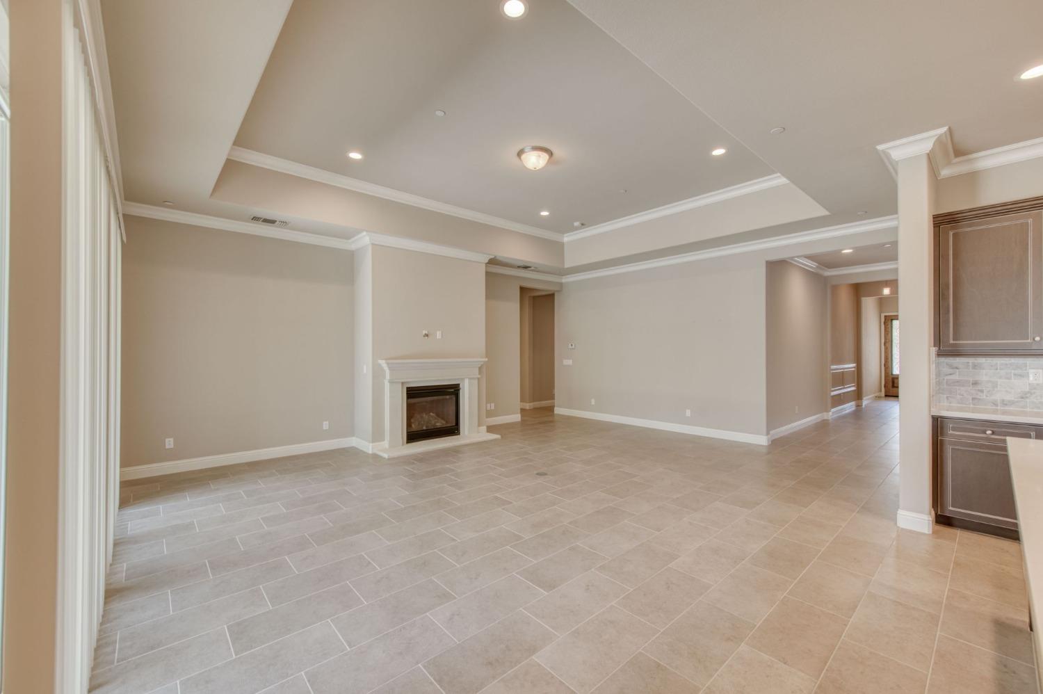 3301 Salem Avenue Clovis, CA 93619 - Photo 19 of 41 a view of an empty room with a fireplace