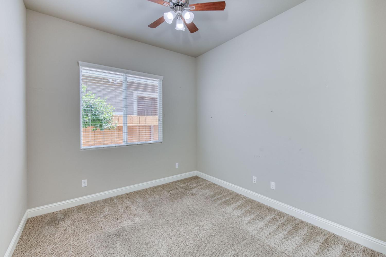 3301 Salem Avenue Clovis, CA 93619 - Photo 23 of 41 an empty room with a window