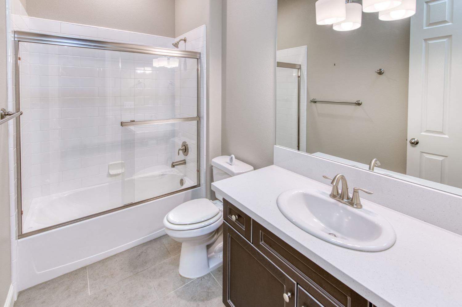 3301 Salem Avenue Clovis, CA 93619 - Photo 25 of 41 a bathroom with a sink toilet and shower