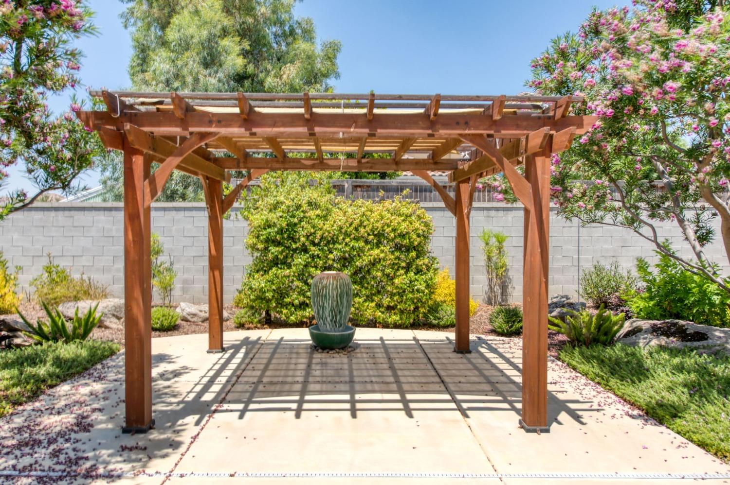 3301 Salem Avenue Clovis, CA 93619 - Photo 36 of 41 a view of a patio with table and chairs and potted plants