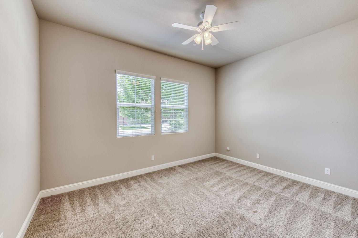 3301 Salem Avenue Clovis, CA 93619 - Photo 6 of 41 an empty room with a window