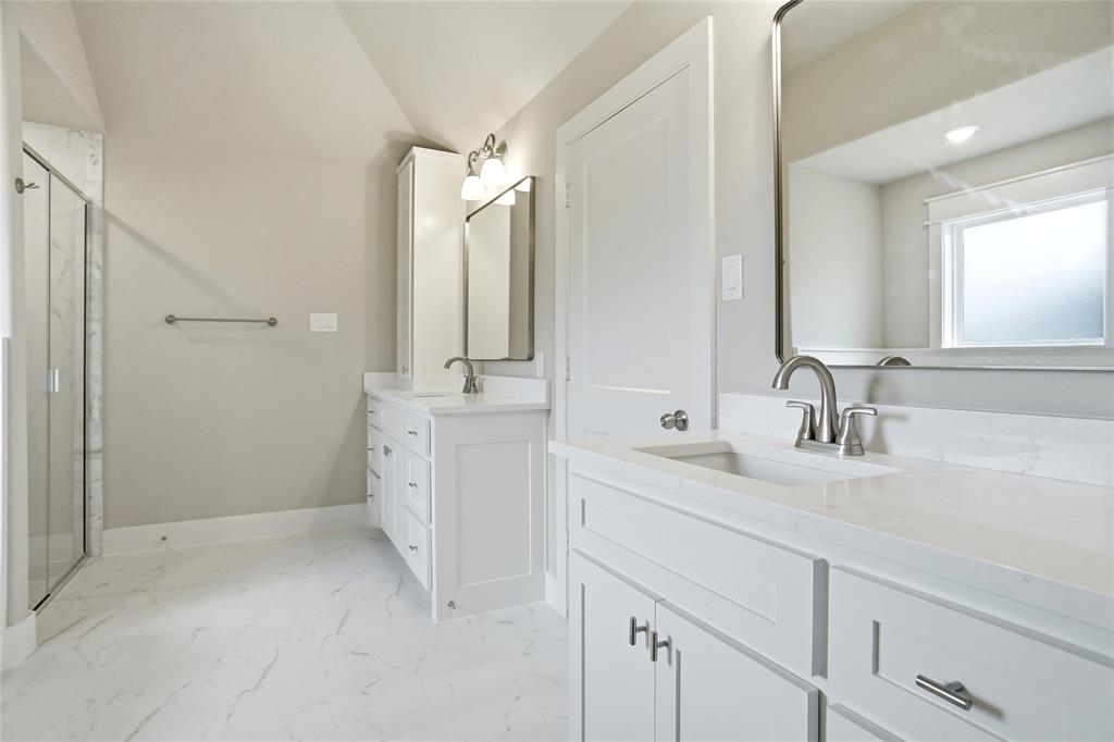 133 Joel Street Springtown, TX 76082 - Photo 9 of 15 a bathroom with a double vanity sink mirror and
