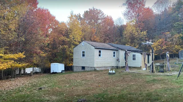 a house view with a garden space