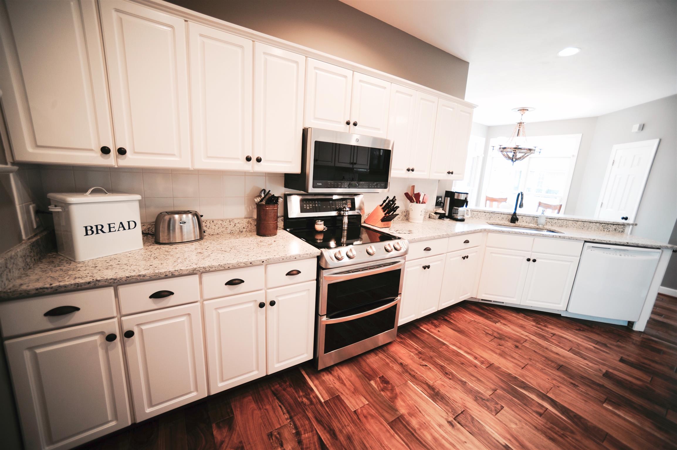 2186 H York Road Pleasant View, TN 37146 - Photo 11 of 30 a kitchen with white cabinets sink and appliances