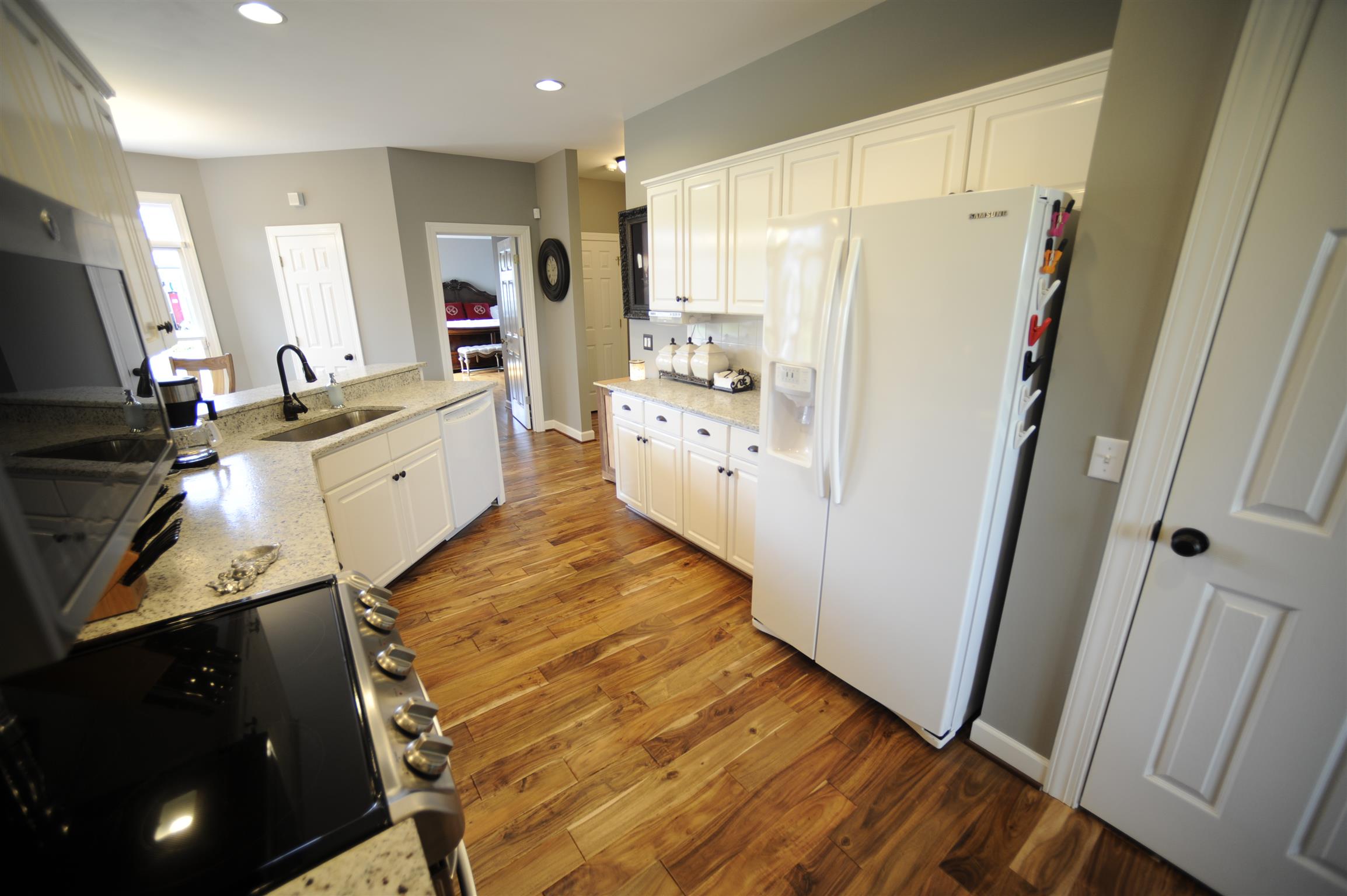 2186 H York Road Pleasant View, TN 37146 - Photo 12 of 30 a large kitchen with a refrigerator a stove a sink and a window