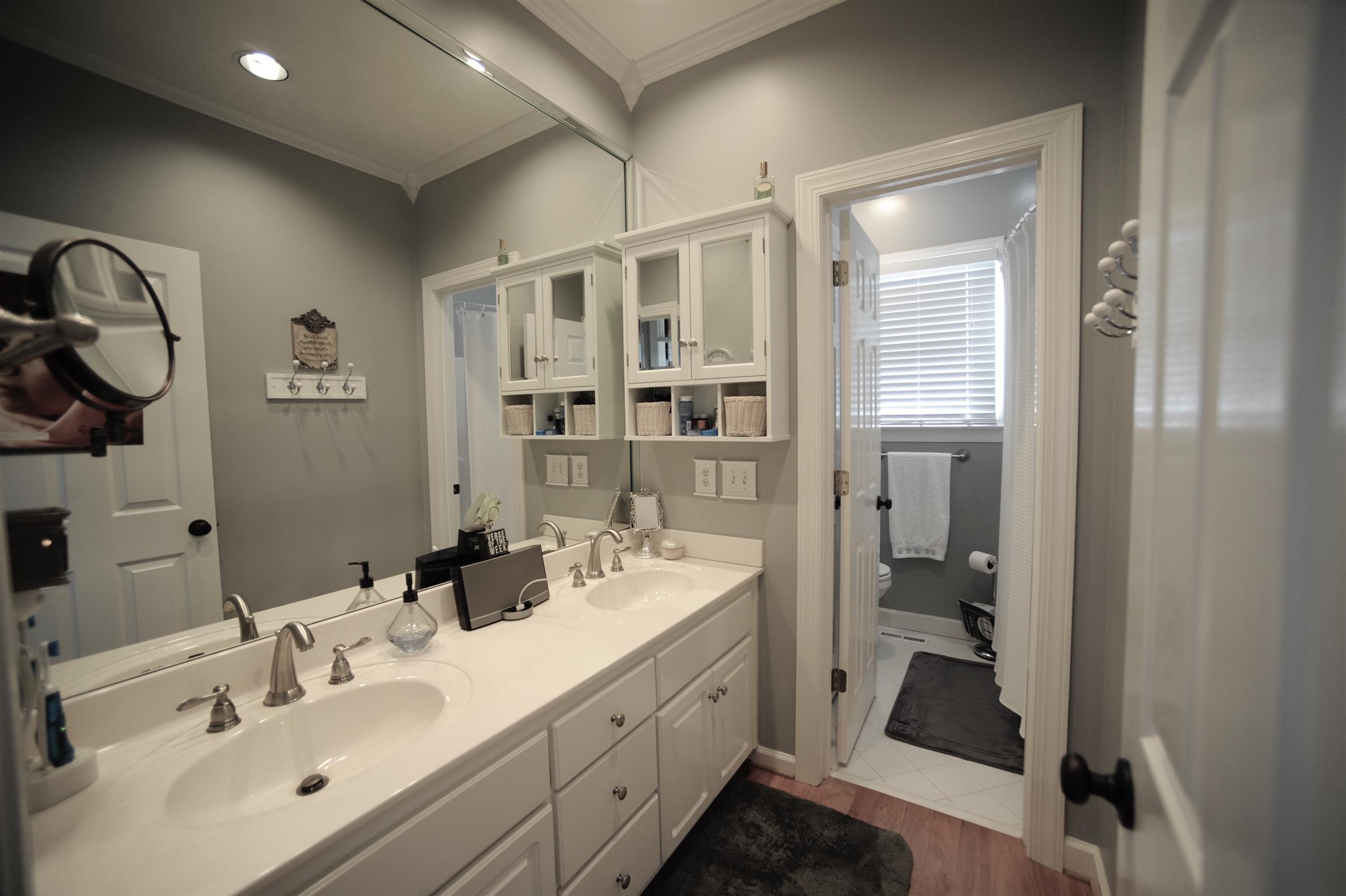 2186 H York Road Pleasant View, TN 37146 - Photo 19 of 30 a spacious bathroom with a double vanity sink a mirror and shower