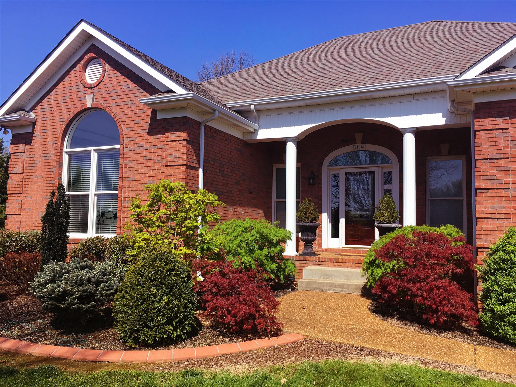 2186 H York Road Pleasant View, TN 37146 - Photo 2 of 30 a front view of a house with garden