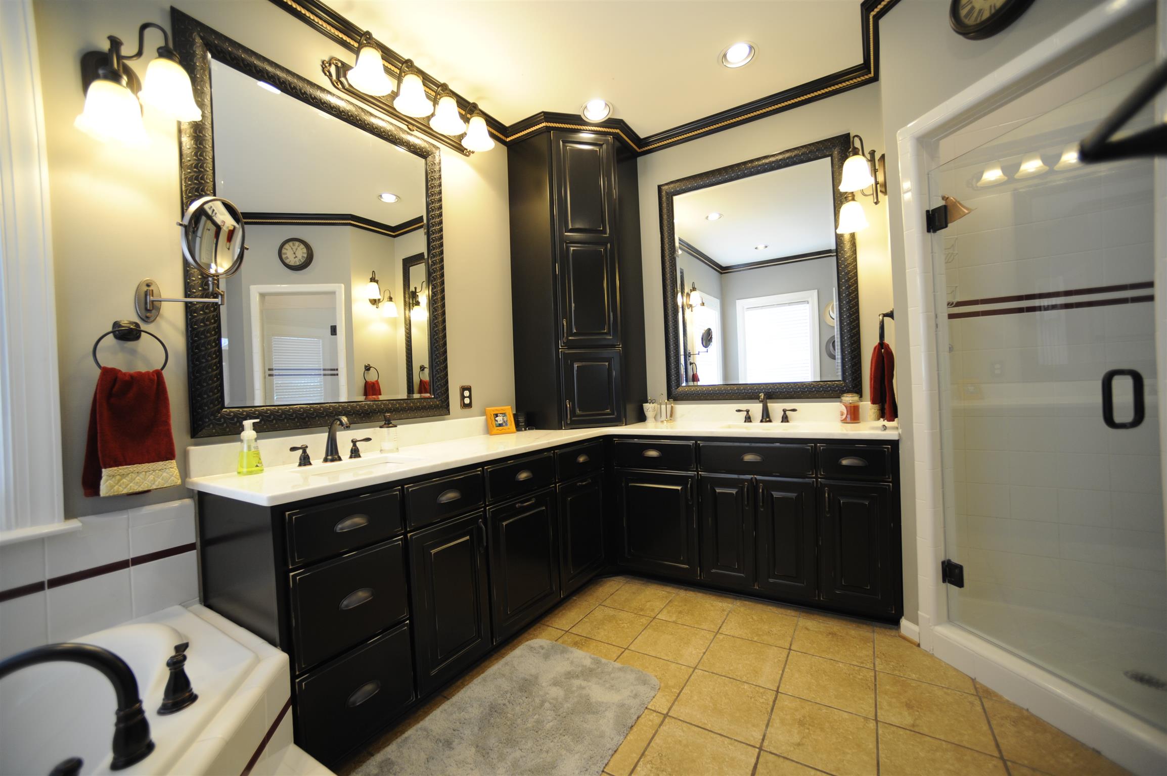 2186 H York Road Pleasant View, TN 37146 - Photo 9 of 30 a spacious bathroom with a double vanity sink and mirror with shower