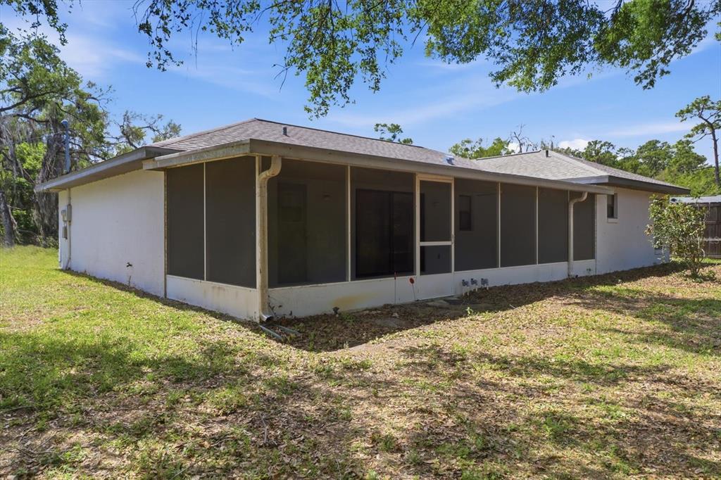 6355 East Rush Street Inverness, FL 34452 - Photo 23 of 27 a view of a house with a yard