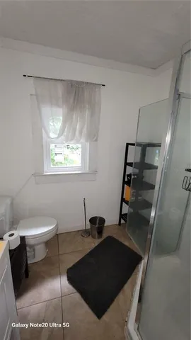 a living room with a couch and a window