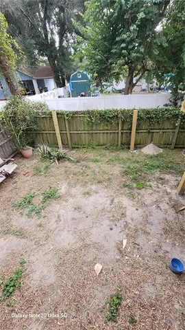 a view of a yard with a trees