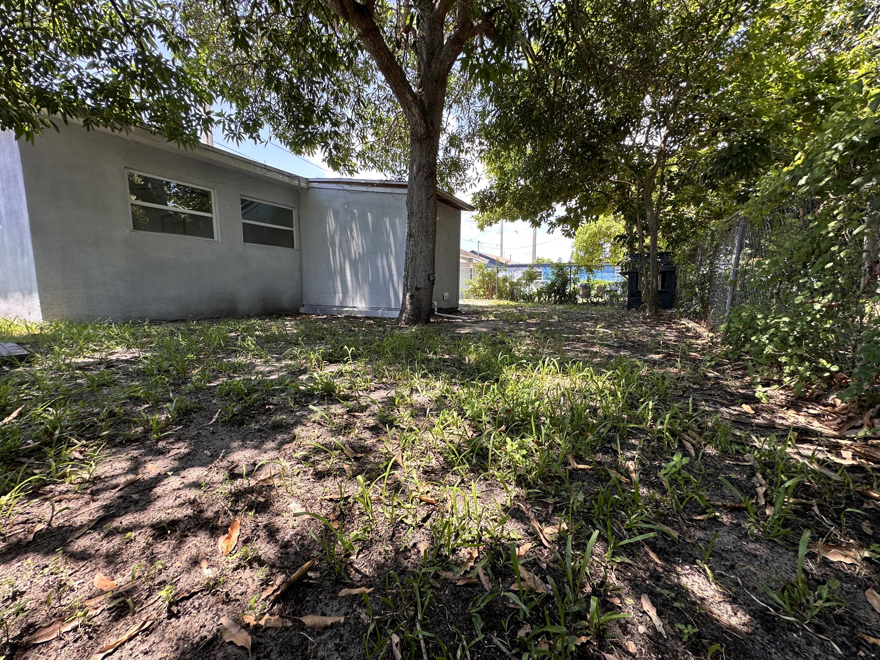 840 West 1st Street Riviera Beach, FL 33404 - Photo 22 of 22 a view of a house with a yard