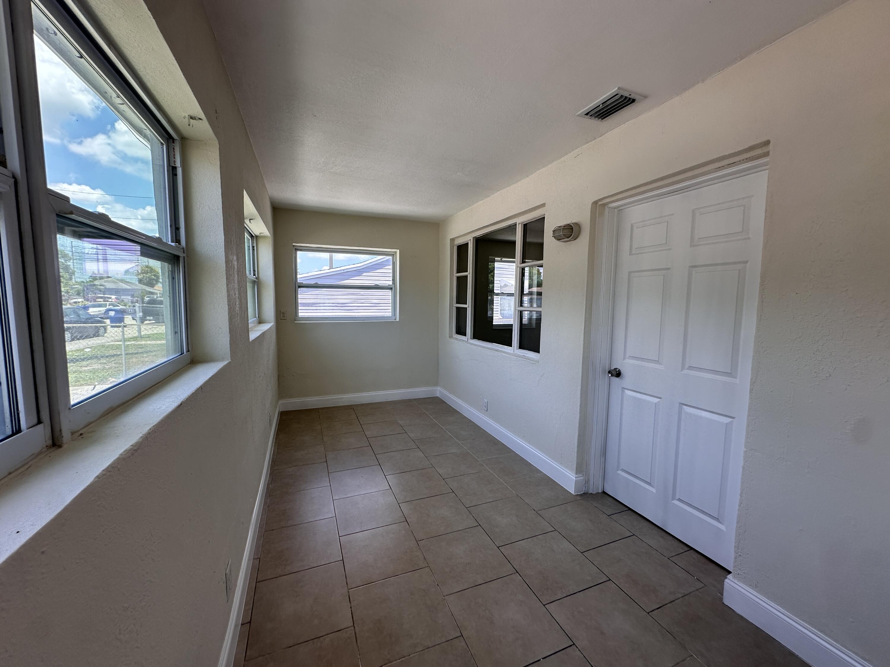 840 West 1st Street Riviera Beach, FL 33404 - Photo 3 of 22 a view of an empty room and window