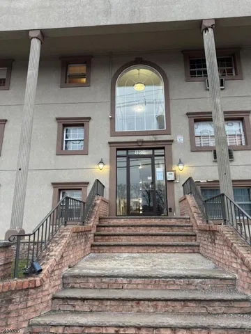 a view of hall way with furniture