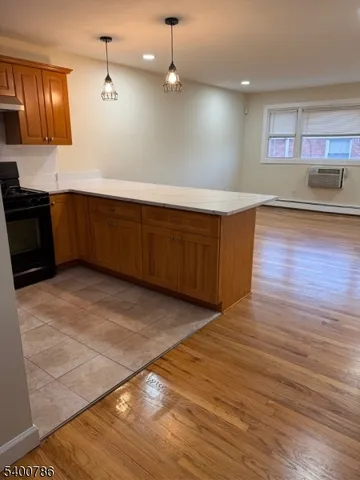 a kitchen with stainless steel appliances a large counter top a sink and a stove