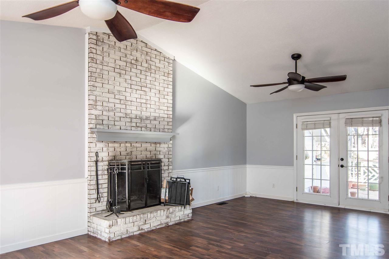 4804 Waybridge Court Raleigh, NC 27606 - Photo 4 of 30 a view of empty room with wooden floor and fan