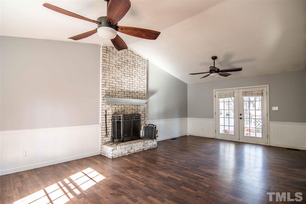 4804 Waybridge Court Raleigh, NC 27606 - Photo 5 of 30 wooden floor in an empty room with a window