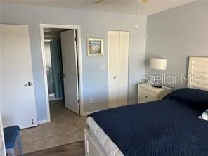 a bedroom with a bed and a walk in closet