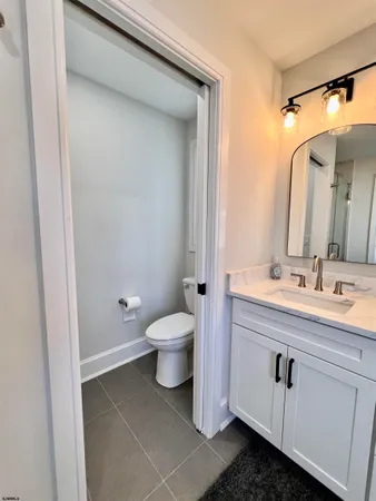 a bedroom with a large bed and a flat screen tv