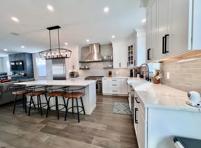 a bathroom with a double vanity sink and mirror