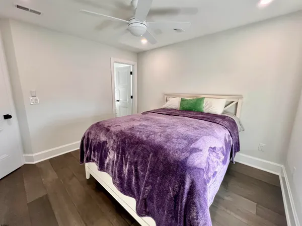 a front view of a building with plants