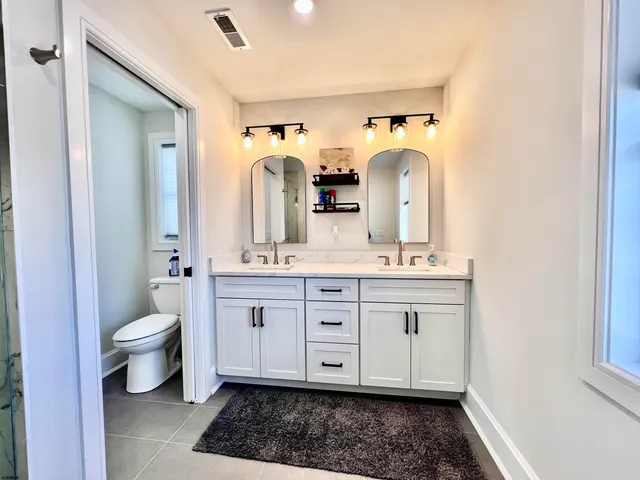 a bed room with a bed and a window