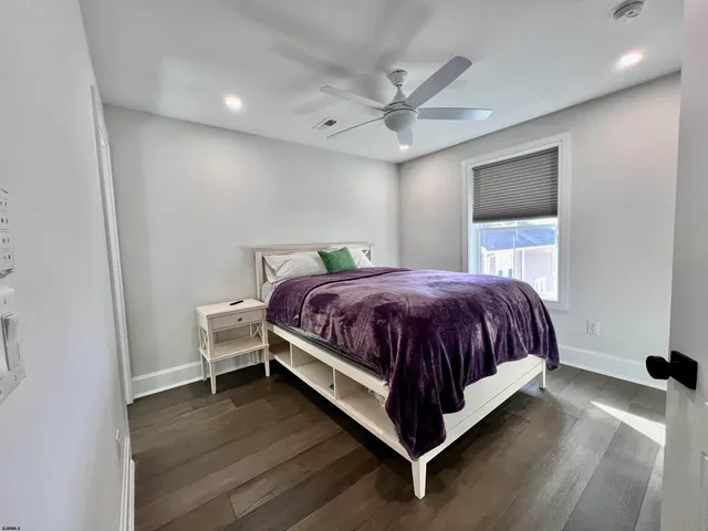 a bed room with a bed and a dresser