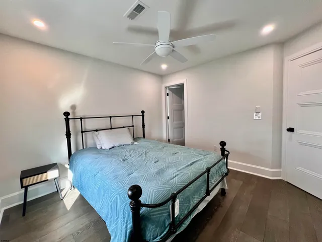 a bedroom with furniture and a window