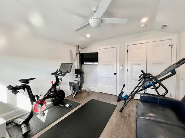 a bathroom with a granite countertop shower and vanity
