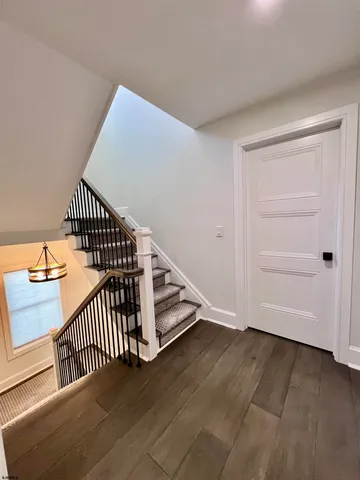 a bathroom with a double vanity sink mirror and toilet