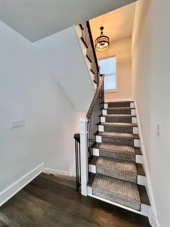 a bedroom with bed and a window
