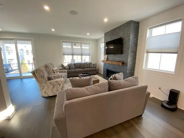 a living room with furniture or kitchen view and a couch